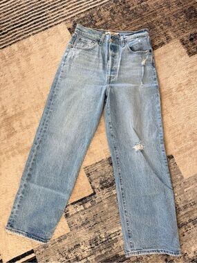 Levi’s Light Wash Straight Leg Jeans with Distressed Detail